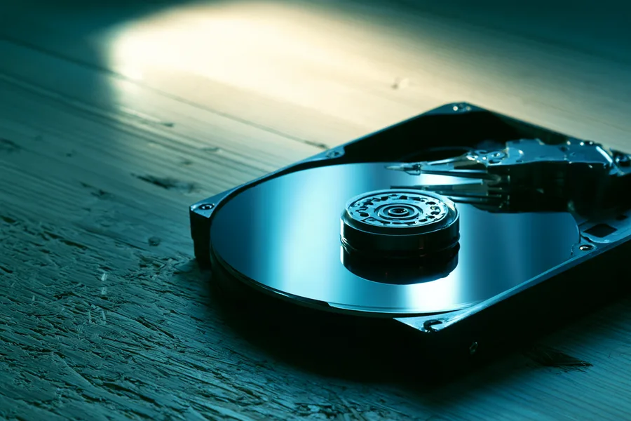Open hard drive platter and read head during data recovery execution