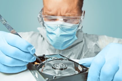 Man Repairs A Hard Drive Disk.